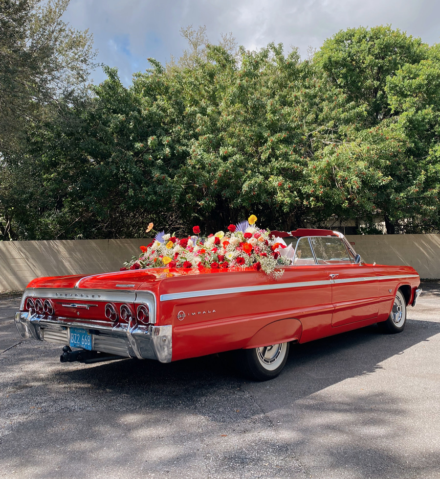Taymir Terrell of Taymir Creative curated this experiential marketing experience to showcase Taymir Creative's talent, event planning, creativity, love, and passion through this floral installation inside this vintage red convertible car on valentines day in Fort Lauderdale, Miami, and West Palm.